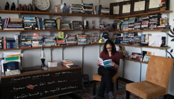 Charisse L’Pree Corsbie Massay sits in her office